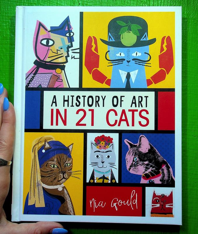 Artistically drawn cats in colorful blue, red, and yellow boxes