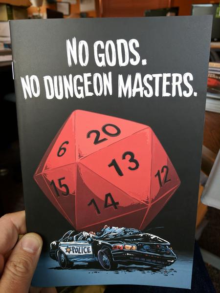 No Gods. No Dungeon Masters. by Io, Andy Warner, Hannah Fisher and Rachel Dukes (an illustration of a giant 20-sided die, 20 facing up, sitting on a smashed police car. It's pretty rad.)