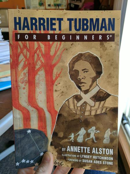 book cover depicting Harriet Tubman in front of three red trees