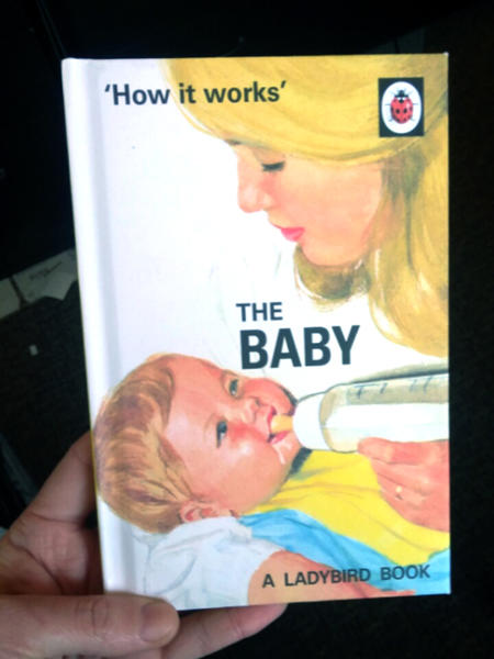 a white woman bottle feeds a baby 