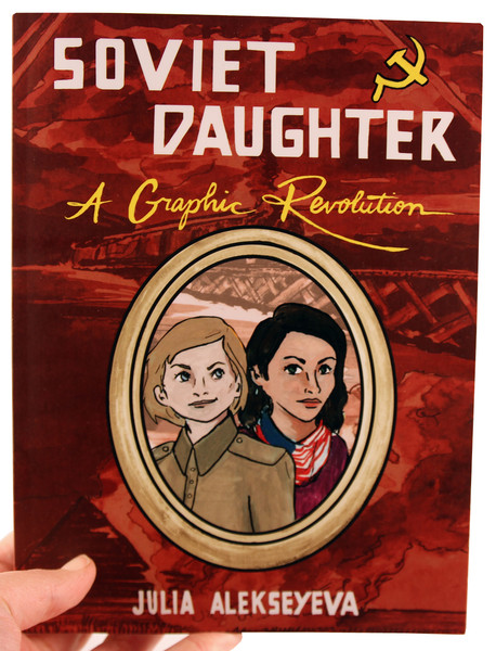 Red book cover with a bridge in the background and a framed portrait of two young girls in front