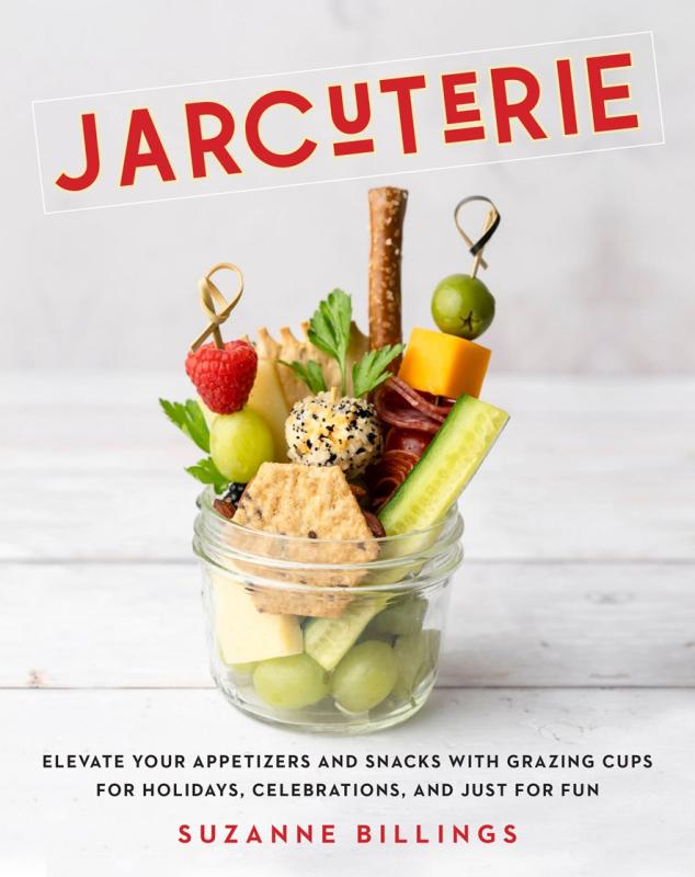 white cover with bold orange text with glass full of fruit and veggies and crackers