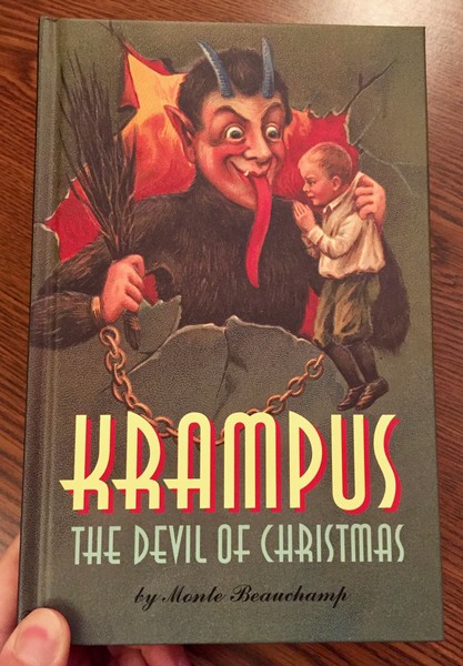 Krampus: The Devil of Christmas by Monte Beauchamp [Krampus gleefully examines a clean-cut child]