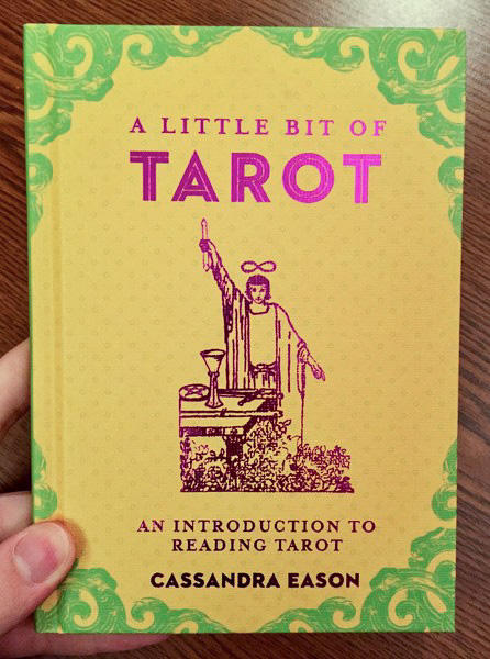 Cover of A Little Bit of Tarot: An Introduction to Reading Tarot which features the Rider-Waite version of the magician on a yellow background
