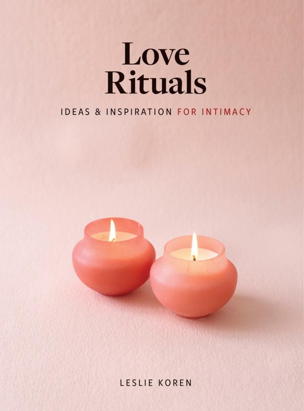 A pink cover shows two pink candles burning.
