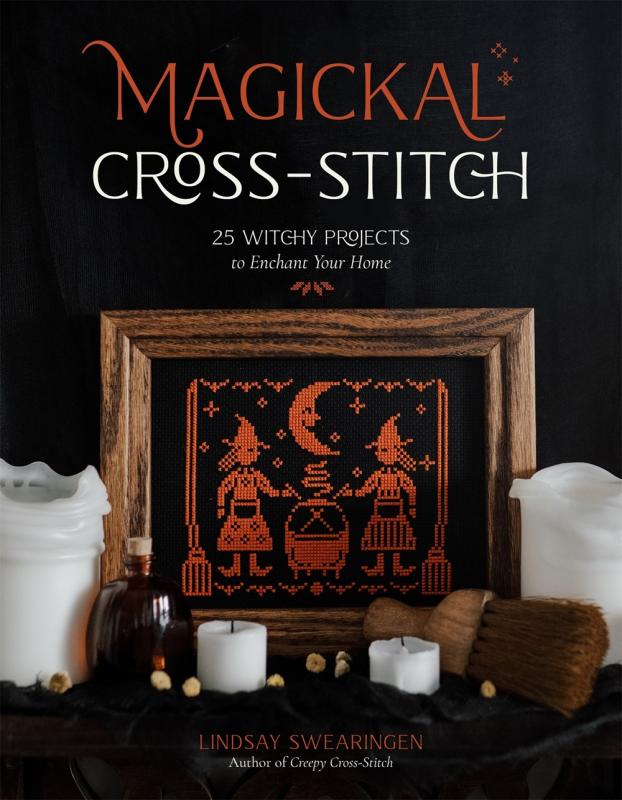 orange cross stitch figures on black cover with orange and white text