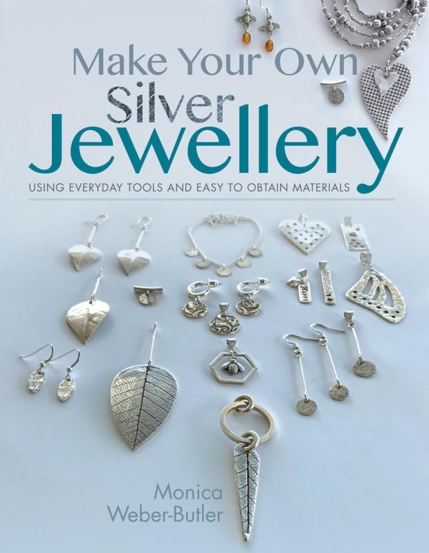 Lots of different kinds of silver jewellery.