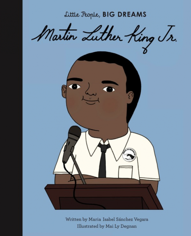 a black cartoon character in a white shirt and tie at a podium