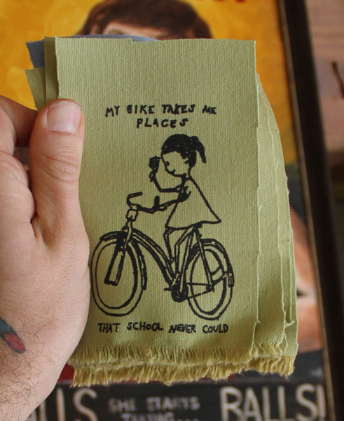 patch with image of person on a bike with the text "my bike takes me place that school never could"