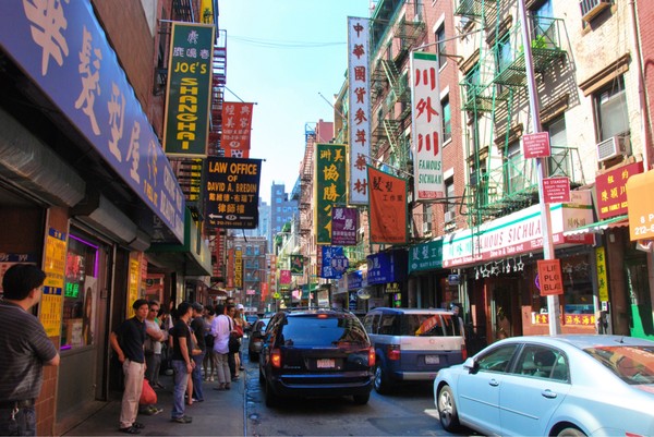 a photo of a crowded street in Chinatown, New York City