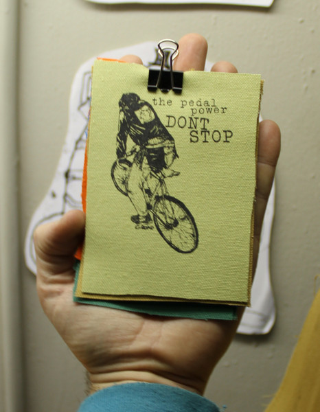 patch with image of person on bike with the text "the pedal power don't stop"