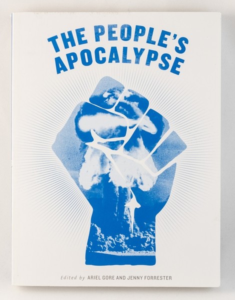 A white book with an image of a blue fist and a mushroom cloud within