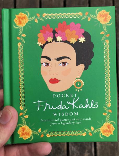 Green background with a yellow border, at the center is an illustration of Frida Kahlo.