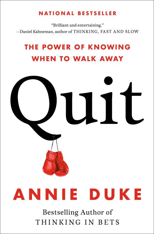 the title in large black letters on a white background, with a small image of boxing gloves hanging off the Q