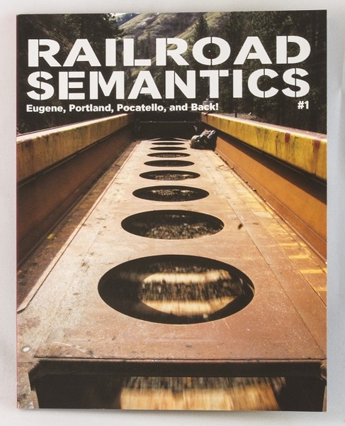 A book with a photo of a train car about to go through a tunnel