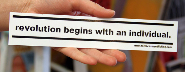 "Revolution begins with an individual" microcosm publishing sticker