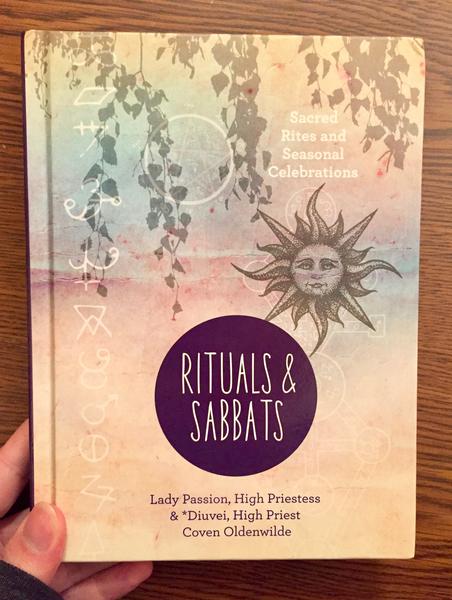 Cover of Rituals & Sabbats: Sacred Rites and Seasonal Celebrations, which features vines coming down from the top edge and a stylized sun