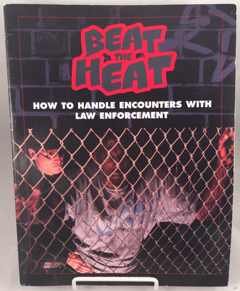 book cover showing a guy getting arrestedbehind metal chain bars
