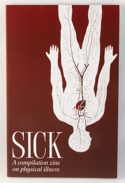 A red book/zine with an upside-down silhouette of a human body and the circulatory system exposed