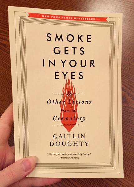 Cover of Smoke Gets in Your Eyes: And Other Lessons from the Crematory which features the title over an orange flame