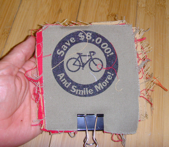 patch with logo of bicycle and text "save $8,000! and smile more!"