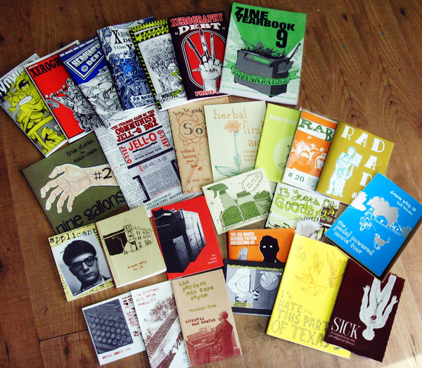 a whole bunch of zines laid out beautifully on the floor.