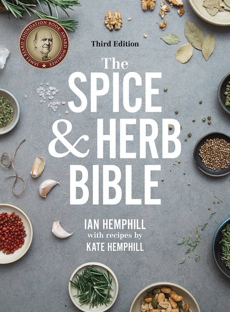 grey cover with white text and small bowls full of herbs and spices