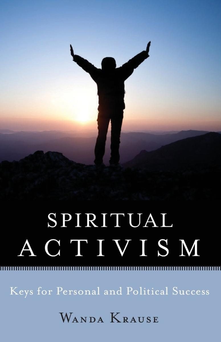 Photo of a person on a mountain, arms outstretched, over a rising sun and blue sky