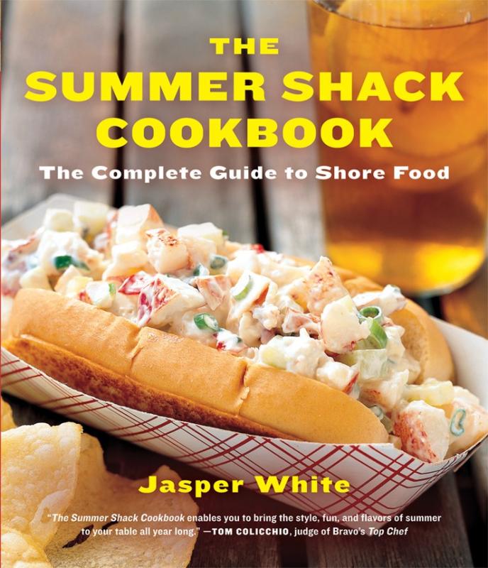 close up of potato salad in a hot dog bun with yellow text