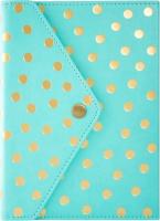 a teal and gold polka dotted journal