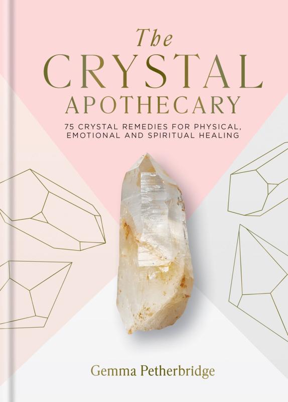 A white and pink cover with a photo of a large crystal.