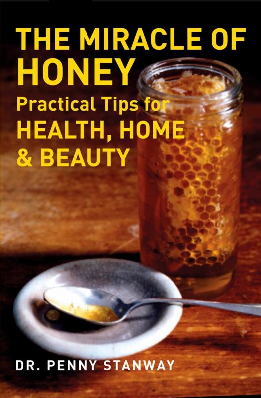 Picture of a jar of honey with spoonful next to it.