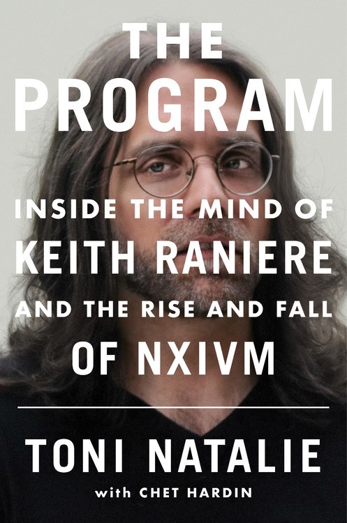 Cover has white text over picture of Keith Raniere