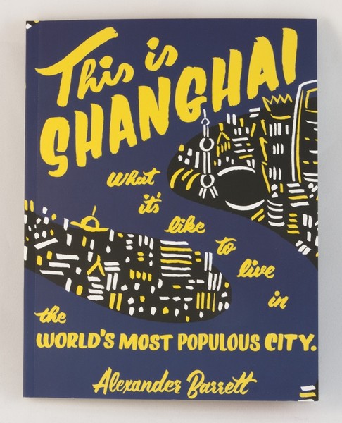 A basic illustration of part of Shanghai at night, on a navy blue cover with yellow text