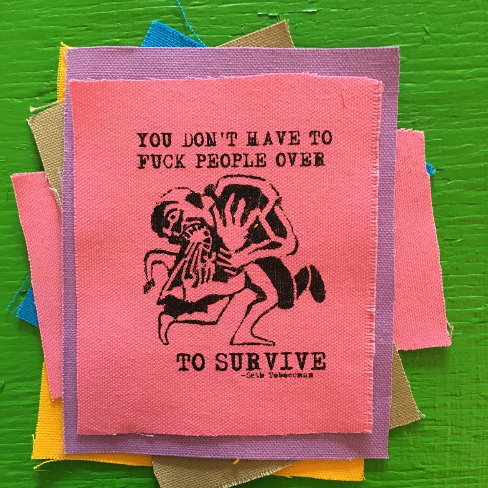 patch with a picture of a monster eating a person and the text "you don't have to fuck people over to survive"