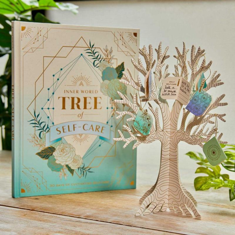 Nice book cover with a little paper tree next to it.