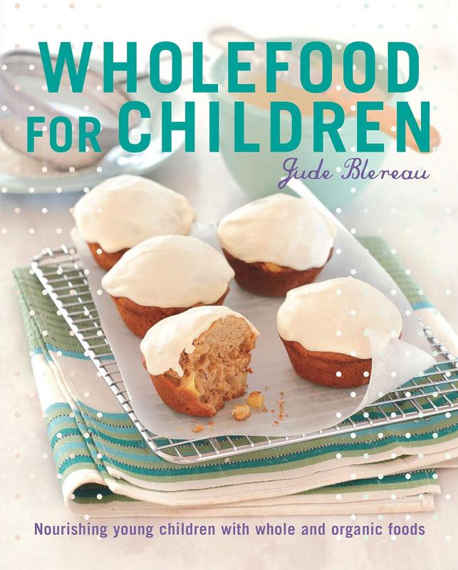 white cover with teal text and tray of muffins 