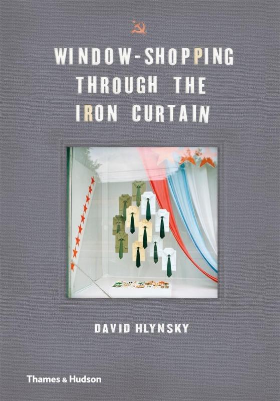 grey cover with white text and communist iconography with shop window