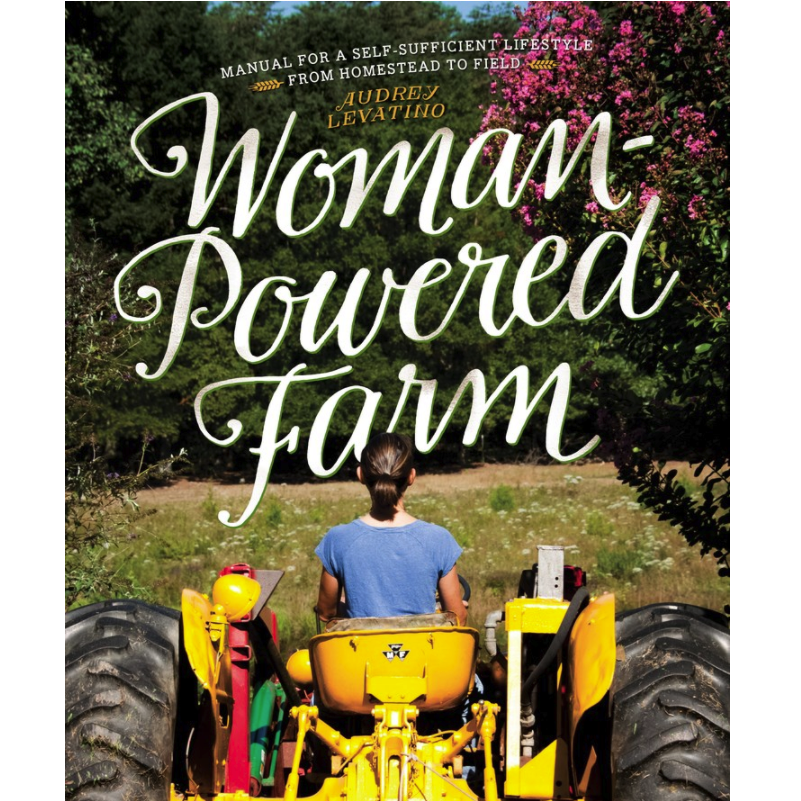 a white woman on a tractor
