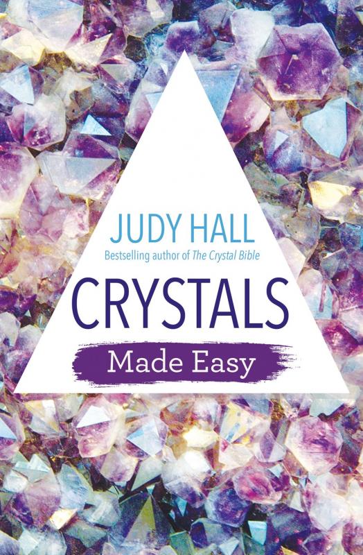 a bunch of purple and white crystals with a white triangle with the title on it superimposed