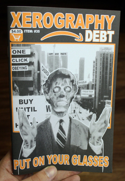 Xerography Debt #35 cover featuring a zombie and the words "put on your glasses"