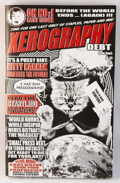 A fancy-looking, future-predicting cat looks over a globe on this zine cover. It looks reminiscent of the national enquirer and publications of the like
