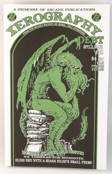 a white, black, and green zine with an illustration of a gargoyle-like kraken-looking being, sitting on a stack of books